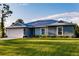 Charming single-story home featuring a well-manicured lawn and attached two-car garage at 16280 Minorca Dr, Punta Gorda, FL 33955