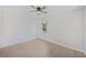 Bright bedroom features neutral paint, wood-look floors and a ceiling fan at 17197 Russell Ave, Port Charlotte, FL 33954