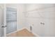 Bright laundry room with access to garage is equipped with laundry hook-ups at 17197 Russell Ave, Port Charlotte, FL 33954
