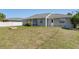 Large backyard with lanai, offering a spacious and private outdoor retreat for relaxation and entertainment at 19468 Edgewater Dr, Port Charlotte, FL 33948