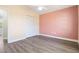 This bedroom has a ceiling fan, new flooring, and a built-in closet for storage at 19468 Edgewater Dr, Port Charlotte, FL 33948