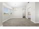 Bright dining room featuring tile flooring, a chandelier, and natural light through large windows at 19468 Edgewater Dr, Port Charlotte, FL 33948