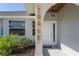 Detailed view of the front door and surrounding architectural details at 19468 Edgewater Dr, Port Charlotte, FL 33948