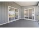 Enclosed lanai with sliding glass doors, offering a versatile space for relaxation and entertaining at 19468 Edgewater Dr, Port Charlotte, FL 33948