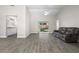 Open living space with stylish tile flooring, vaulted ceiling, and easy access to the kitchen and backyard at 19468 Edgewater Dr, Port Charlotte, FL 33948