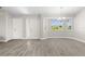 Spacious living room with tile flooring and a front door at 19468 Edgewater Dr, Port Charlotte, FL 33948