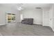 Comfortable living room featuring tile flooring and sliding glass doors leading to the patio at 19468 Edgewater Dr, Port Charlotte, FL 33948