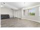 Bright living room with tile flooring, natural light, and neutral wall paint at 19468 Edgewater Dr, Port Charlotte, FL 33948