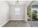 Living space with tile floors, recessed lighting, and access to outdoor screened porch at 19468 Edgewater Dr, Port Charlotte, FL 33948