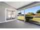 Relaxing screened porch with views of a landscaped yard and a peek at the neighboring houses at 19468 Edgewater Dr, Port Charlotte, FL 33948