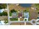 An aerial shot of three homes, each with a private pool and well-manicured lawns at 2152 Taiwan Ct, Punta Gorda, FL 33983