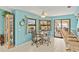 Charming dining area with sliding door access and views of the pool at 2152 Taiwan Ct, Punta Gorda, FL 33983