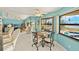 Bright dining area with views of the pool and surrounding landscape at 2152 Taiwan Ct, Punta Gorda, FL 33983