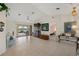Bright, open living area with tile floors, leading to a screened lanai overlooking the water at 2152 Taiwan Ct, Punta Gorda, FL 33983