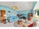 Comfortable living room with a ceiling fan, tile floors, and great natural light at 2152 Taiwan Ct, Punta Gorda, FL 33983