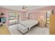 Cozy main bedroom with sliding door access to the pool and outdoor space at 2152 Taiwan Ct, Punta Gorda, FL 33983