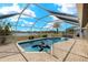 The in-ground swimming pool features a safety net, lake views, dolphin float and patio at 2152 Taiwan Ct, Punta Gorda, FL 33983