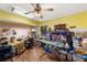 Bright room features wooden floors, yellow walls, sewing and crafting items, plus lots of storage at 2152 Taiwan Ct, Punta Gorda, FL 33983