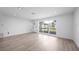 Bright and airy living room with new flooring, recessed lighting and modern windows at 2166 Beacon Dr, Port Charlotte, FL 33952