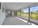 Enclosed patio with screen windows offering views of the landscape and outdoor space at 2166 Beacon Dr, Port Charlotte, FL 33952