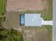 Aerial view of the home from above the backyard and pool at 223 Australian Dr, Rotonda West, FL 33947