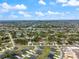 Aerial view of the neighborhood with the home marked by a red dot at 223 Australian Dr, Rotonda West, FL 33947