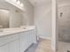 The bathroom has double sinks with a shower at 223 Australian Dr, Rotonda West, FL 33947