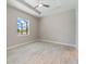 This is a spacious bedroom with hard surface floors and large window at 223 Australian Dr, Rotonda West, FL 33947