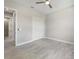An empty bedroom features hard surface floors and a closet at 223 Australian Dr, Rotonda West, FL 33947