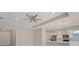 Bright open-concept living room adjacent to modern kitchen with views, recessed lighting and ceiling fan at 223 Australian Dr, Rotonda West, FL 33947