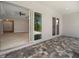Covered patio with a sliding glass door to the house at 223 Australian Dr, Rotonda West, FL 33947
