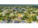 Aerial view of a home with a pool, landscaping and neighborhood at 2300 Carpenter Ln, North Port, FL 34286
