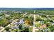 Neighborhood aerial view featuring the home with a pool surrounded by mature trees at 2300 Carpenter Ln, North Port, FL 34286
