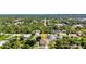 Aerial view of a suburban home with lush landscaping and a central location, indicated by a map pin at 2300 Carpenter Ln, North Port, FL 34286