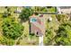 Aerial view showcasing the home's layout, pool, landscaping, and overall property at 2300 Carpenter Ln, North Port, FL 34286
