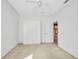 Bright bedroom featuring neutral carpet and a built-in wardrobe at 2300 Carpenter Ln, North Port, FL 34286