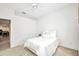Bright bedroom with neutral carpet and a bed at 2300 Carpenter Ln, North Port, FL 34286