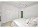 Bright bedroom with neutral carpet, a bed and large closet at 2300 Carpenter Ln, North Port, FL 34286
