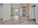 Spacious living area featuring tile flooring, natural light, and an open-concept layout at 2300 Carpenter Ln, North Port, FL 34286