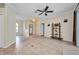 Inviting living area showcases neutral paint colors, tile flooring and access to the backyard at 2300 Carpenter Ln, North Port, FL 34286