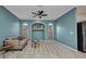 Comfortable living room featuring a ceiling fan, decorative niche, and a stylish area rug at 2300 Carpenter Ln, North Port, FL 34286
