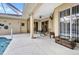 Covered patio featuring ceiling fan and sliding doors at 2300 Carpenter Ln, North Port, FL 34286