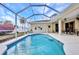 Beautiful private pool is surrounded by a screened enclosure for outdoor fun and relaxation at 2300 Carpenter Ln, North Port, FL 34286