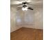 Cozy bedroom with hardwood floors, natural light, and modern ceiling fan at 23220 Rountree Ave, Port Charlotte, FL 33980