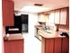 Bright kitchen featuring stainless steel appliances and ample countertop space for meal preparation at 23220 Rountree Ave, Port Charlotte, FL 33980