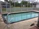 A refreshing screened-in pool with ample space for relaxation and recreation at 23220 Rountree Ave, Port Charlotte, FL 33980