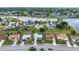 Panoramic aerial shot of a residential area with waterfront access showcasing a series of well-maintained houses at 2442 Rio De Janeiro Ave, Punta Gorda, FL 33983
