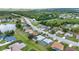 Neighborhood aerial view showcasing the houses and surrounding green spaces in a quiet residential area at 2442 Rio De Janeiro Ave, Punta Gorda, FL 33983