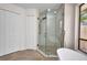 Modern bathroom featuring a frameless glass shower and a standalone tub at 2442 Rio De Janeiro Ave, Punta Gorda, FL 33983