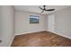 Bedroom features hardwood floors and a window offering natural light at 2442 Rio De Janeiro Ave, Punta Gorda, FL 33983